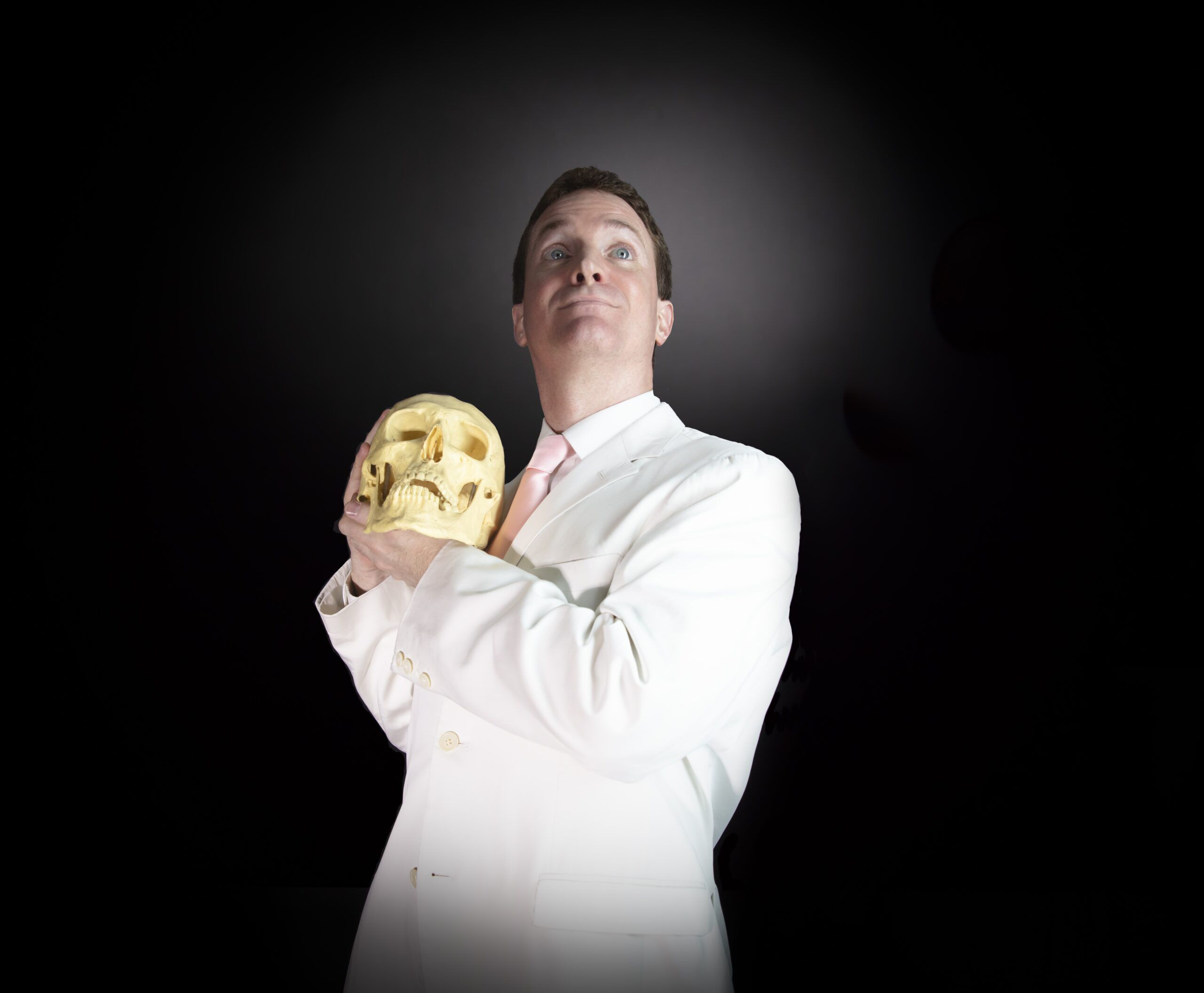 a photo of Grady Hendrix holding a skull