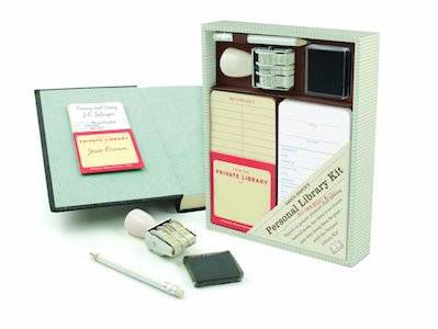 image of a personal home library kit with stamp, book cards, and notepad